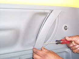 removing handle trim from door panel